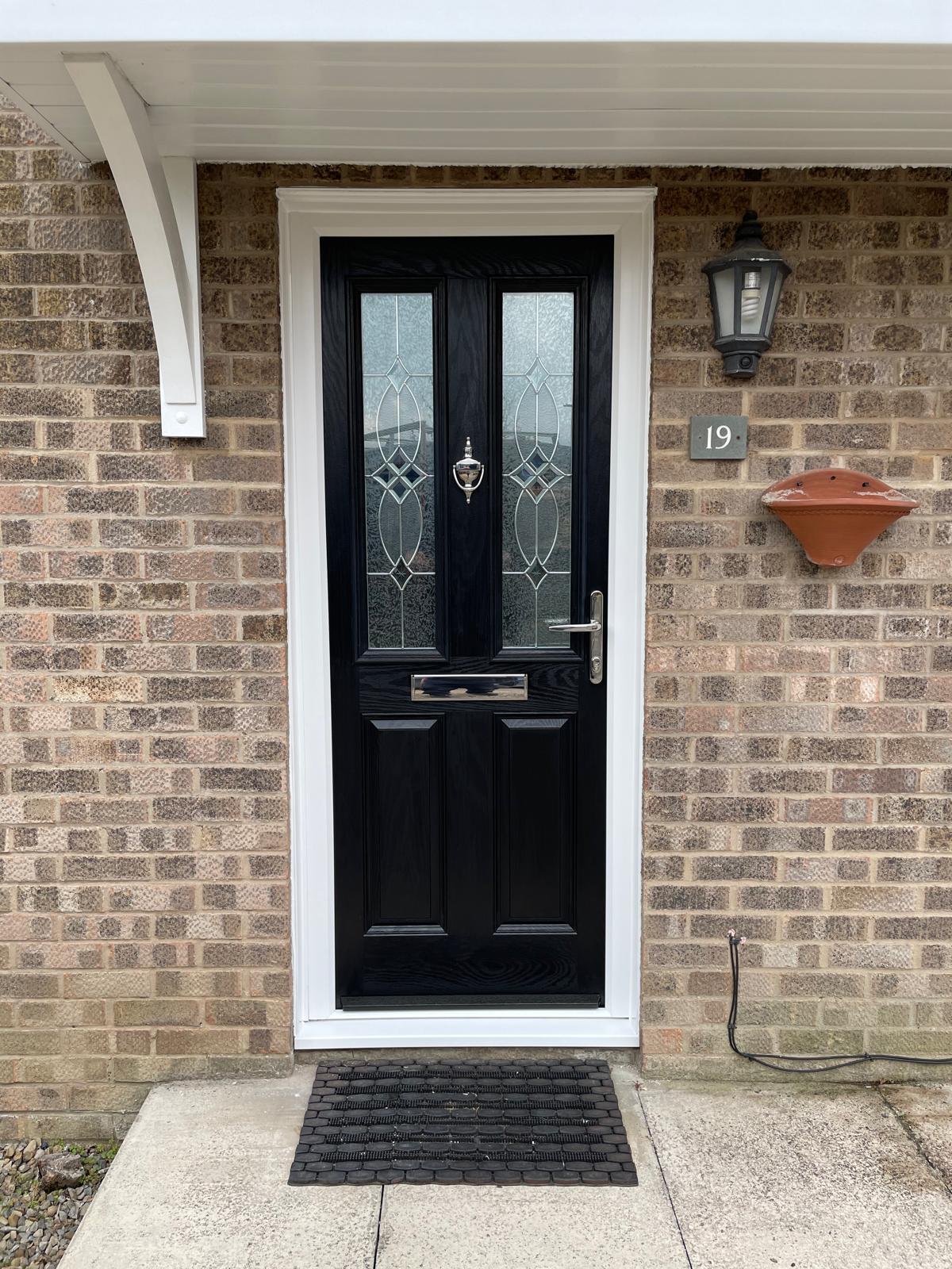 Black composite door with starburst glazing Lincolnshire